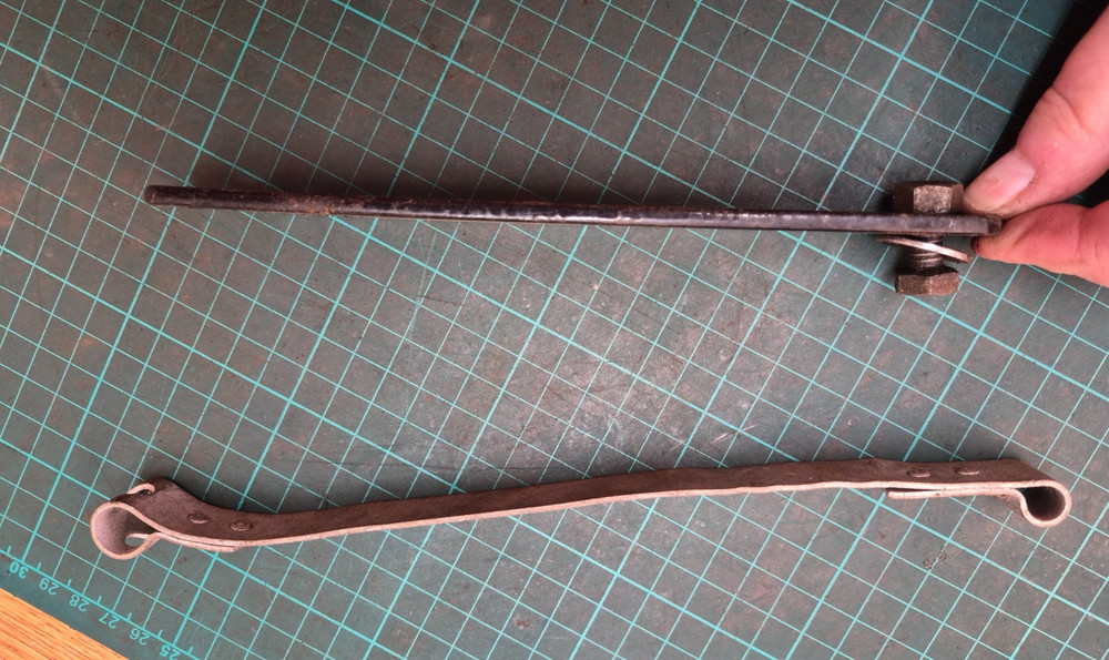 BSA battery Strap and piece of tin ware