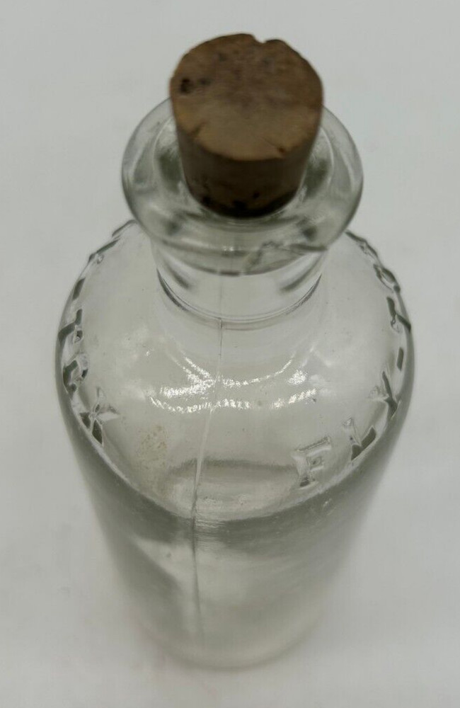 Clear small Fly Tox bottle with cork
