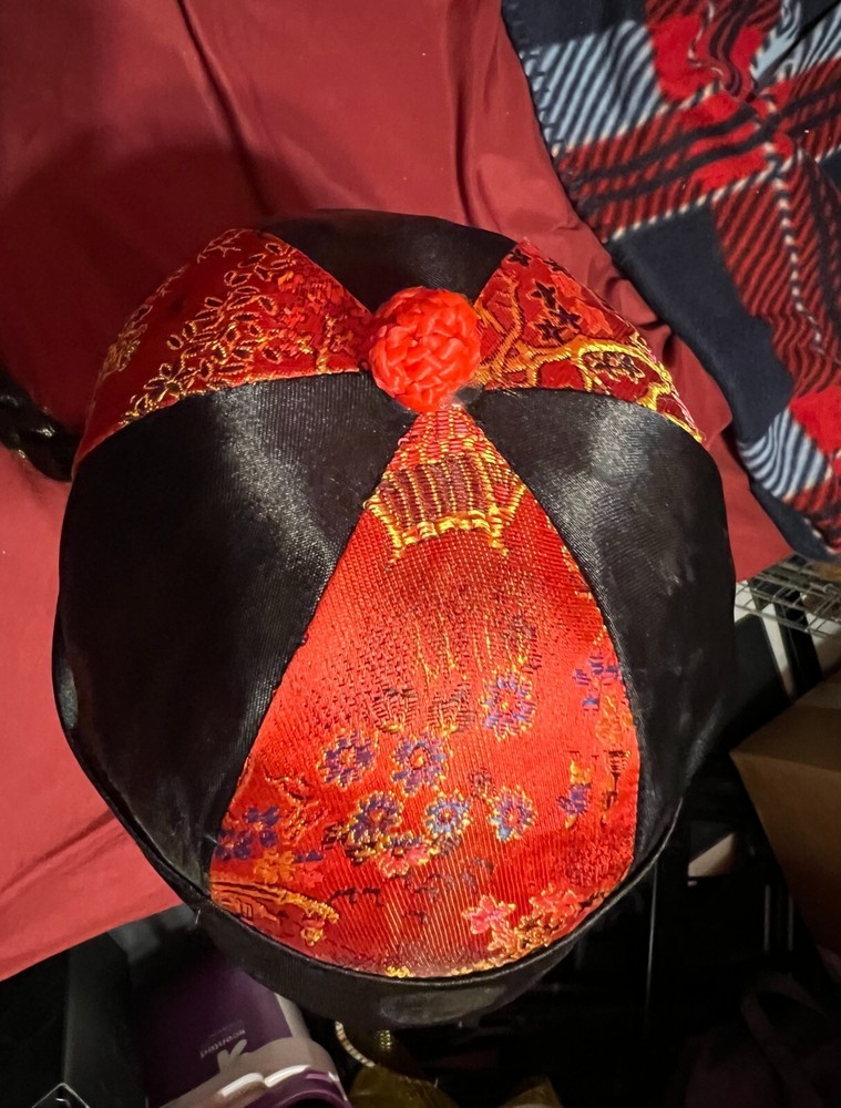 Oriental costume hat with long black braid