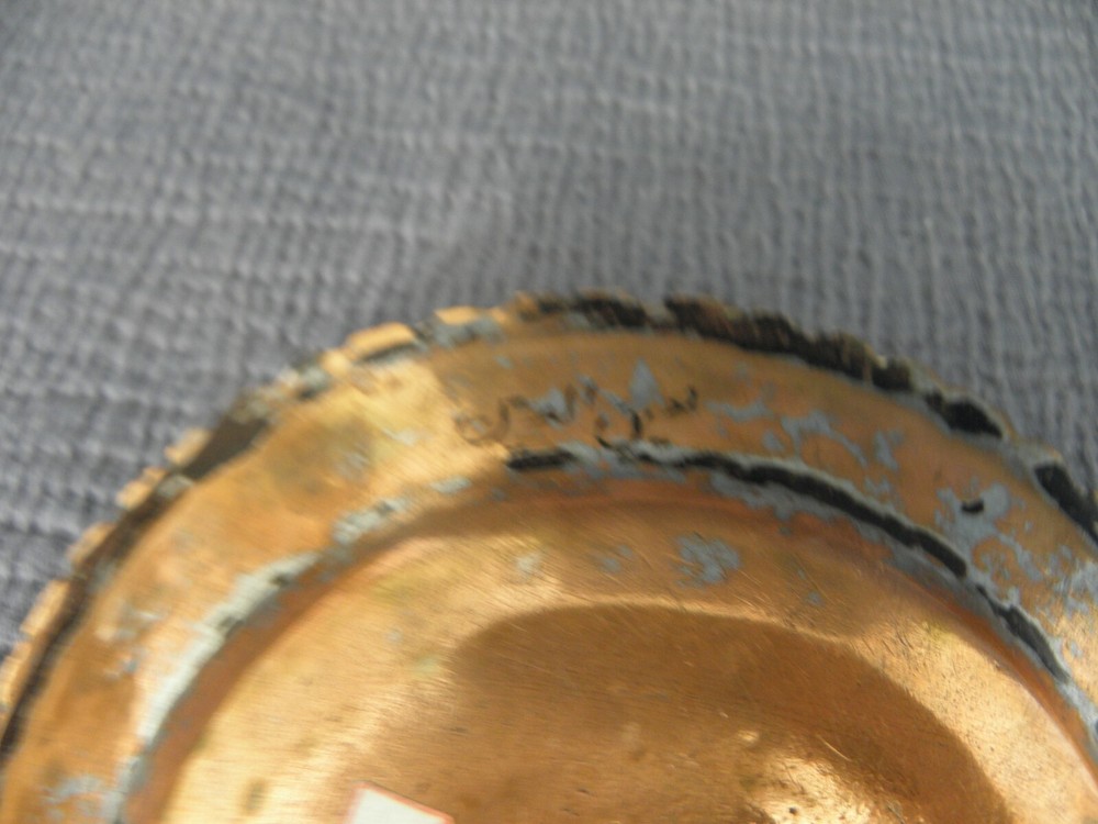 Pair of copper Middle Eastern dishes, both signed