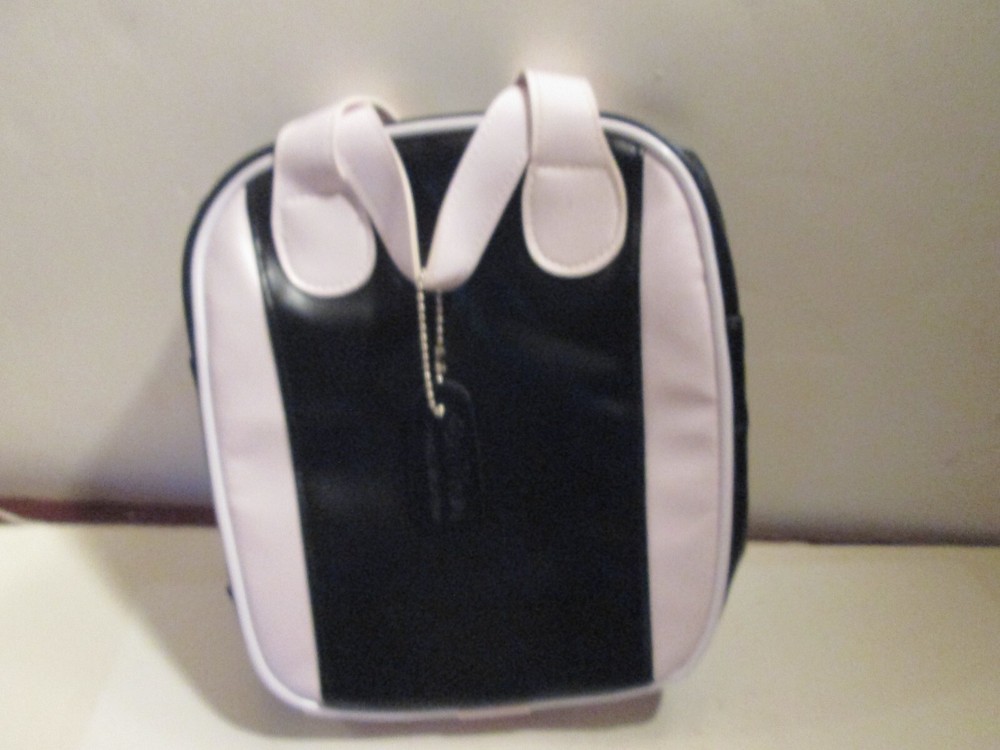 SMALL BLACK AND WHITE "CAL-NEVA" PURSE.