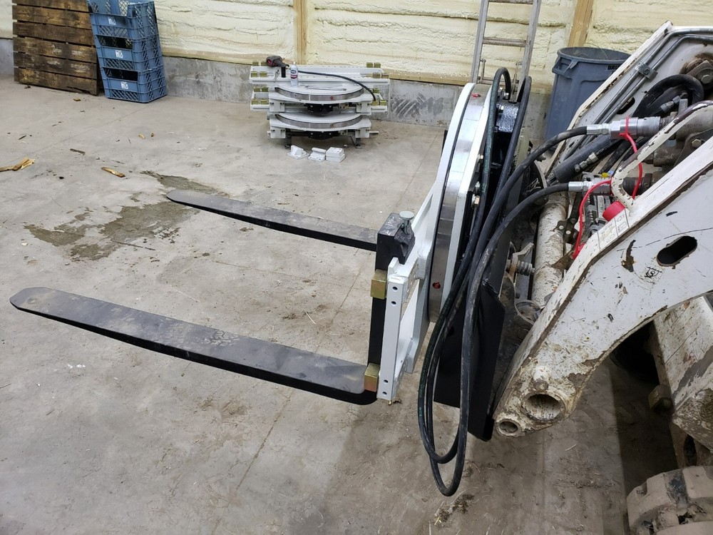 Skidsteer Bobcat fork rotator--- NEW WITH WARRANTY!!!