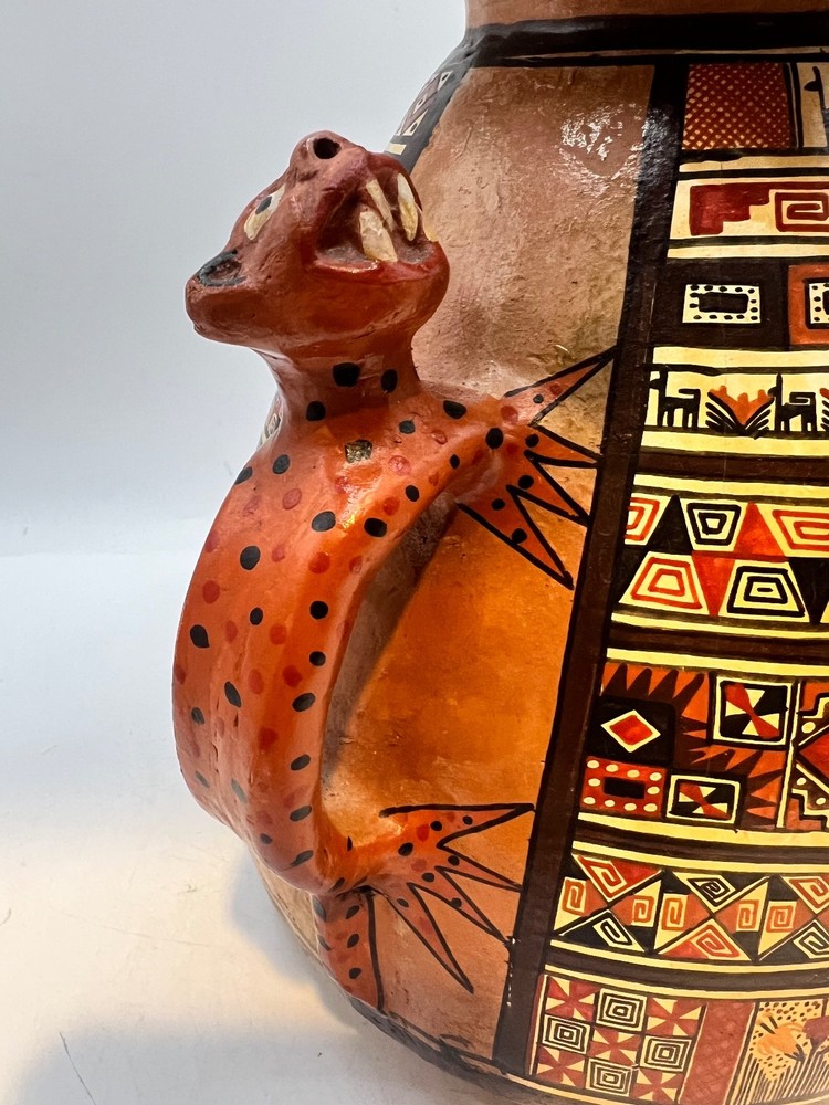 Peruvian ceramic stirrup vase with Jaguar handles and geometric designs