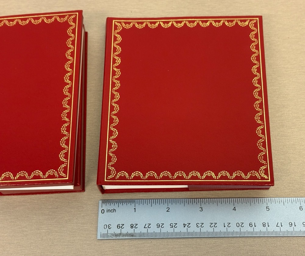 Two Cartier Original Certificate & Instruction Booklet's