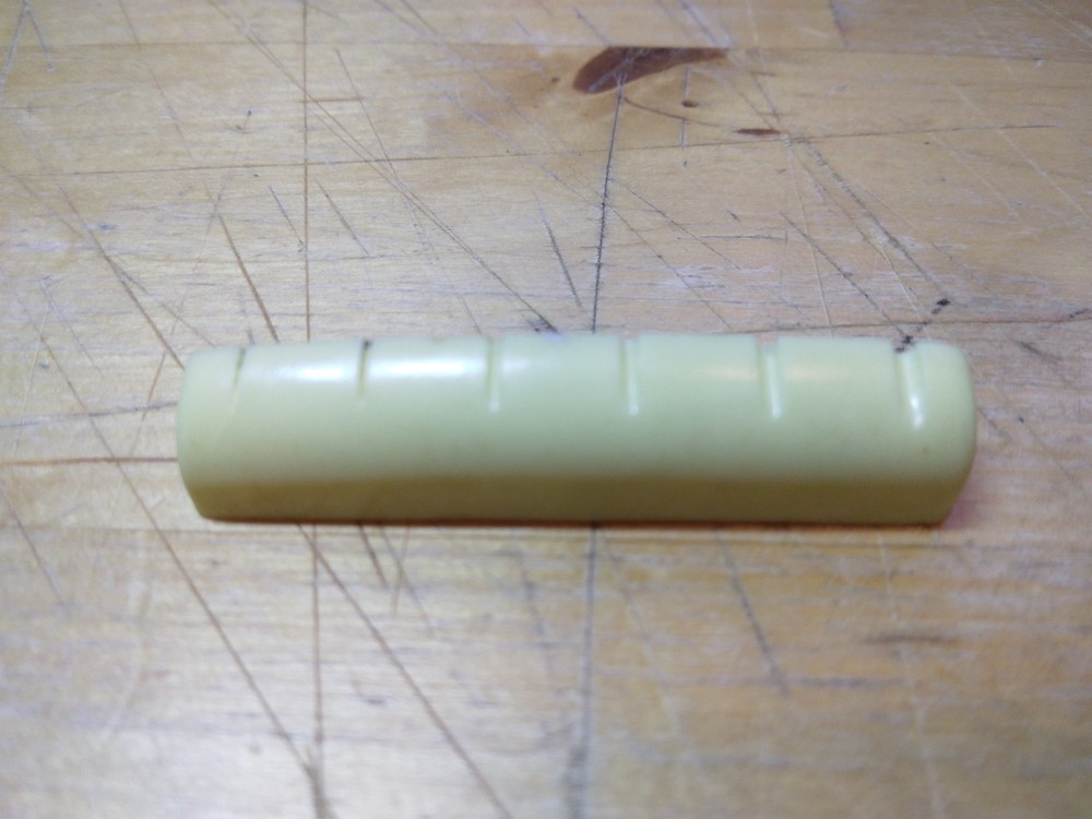Vintage unbranded Plastic guitar Nut, white