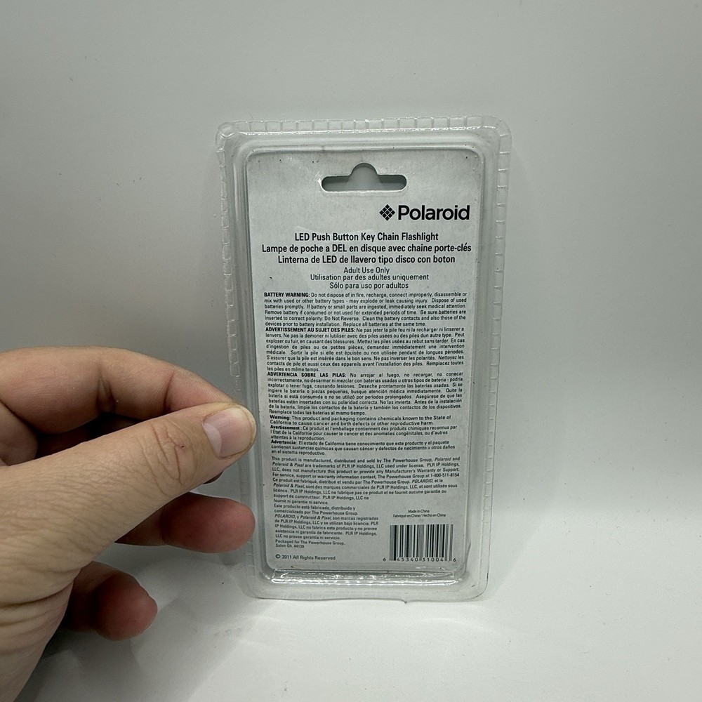 POLAROID LED PUSH BUTTON DISC KEY CHAIN FLASHLIGHT (31004)