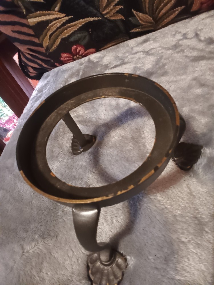 Brushed silver ball,or orb on painted brass base.
