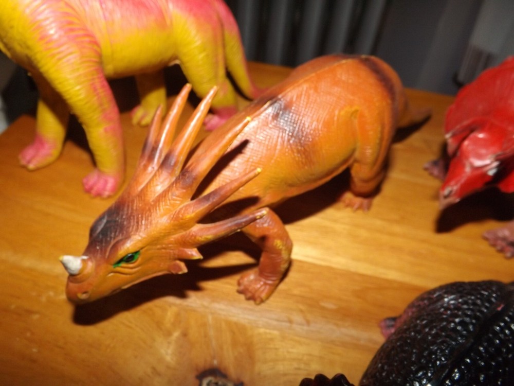 FOUR LARGER SIZED RUBBER DINOSAURS FROM 1985 MADE IN CHINA