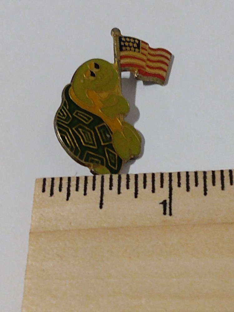 Turtle Figure Holding American Flag Lapel Pin