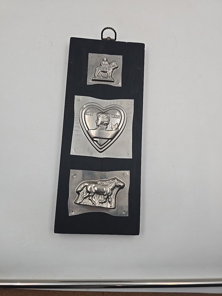 Chocolate Tin Molds On Wood Wall Hanging Display