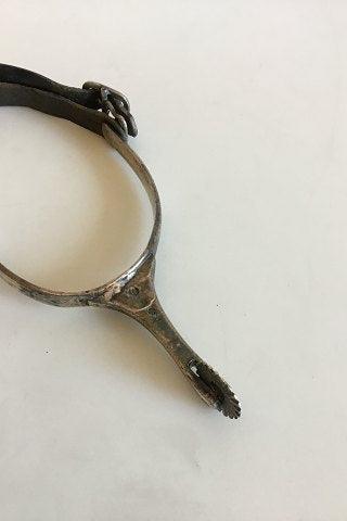 Stirrup with Spur of silver and leather strap.