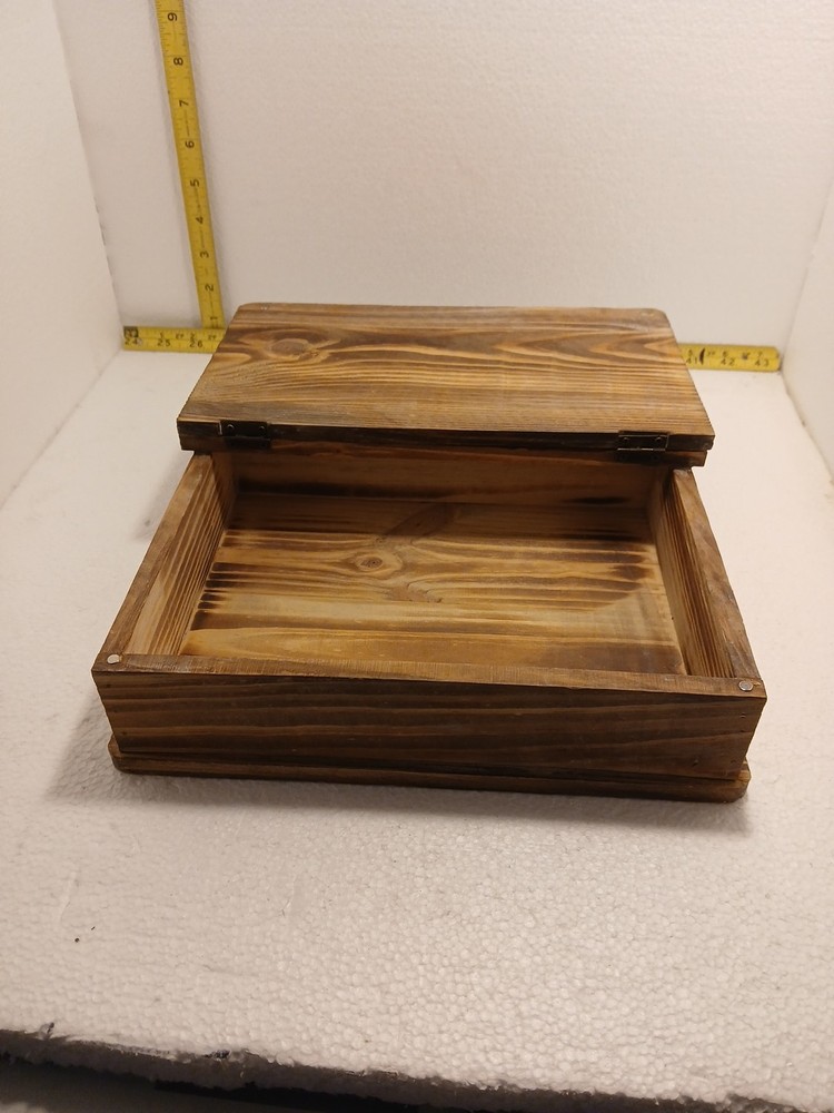 small wooden box with hinged lid