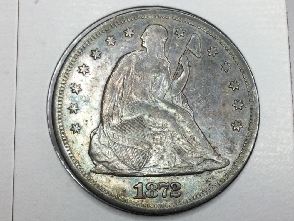 1872-P Seated Dollar in almost uncirculated