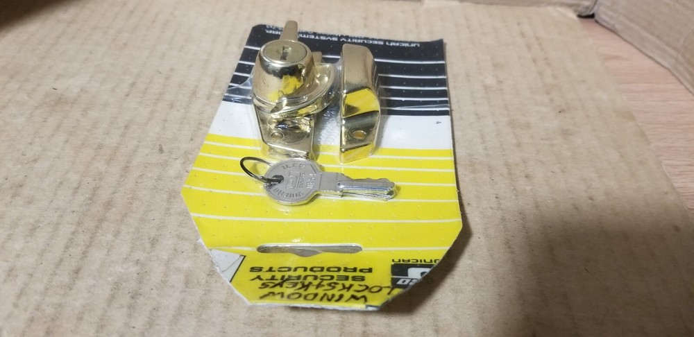 ilco Unican Security Products Brass Security Window Lock. NOS-Damaged packaging