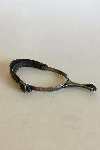 Stirrup with Spur of silver and leather strap.