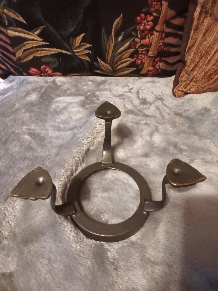 Brushed silver ball,or orb on painted brass base.