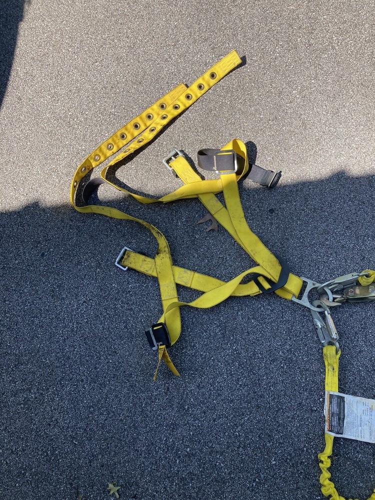 safety harness with strap attached