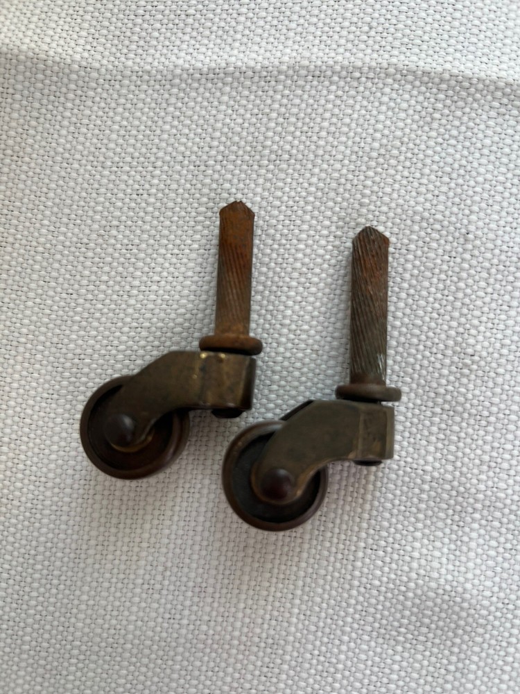 Two Antique Metal Casters