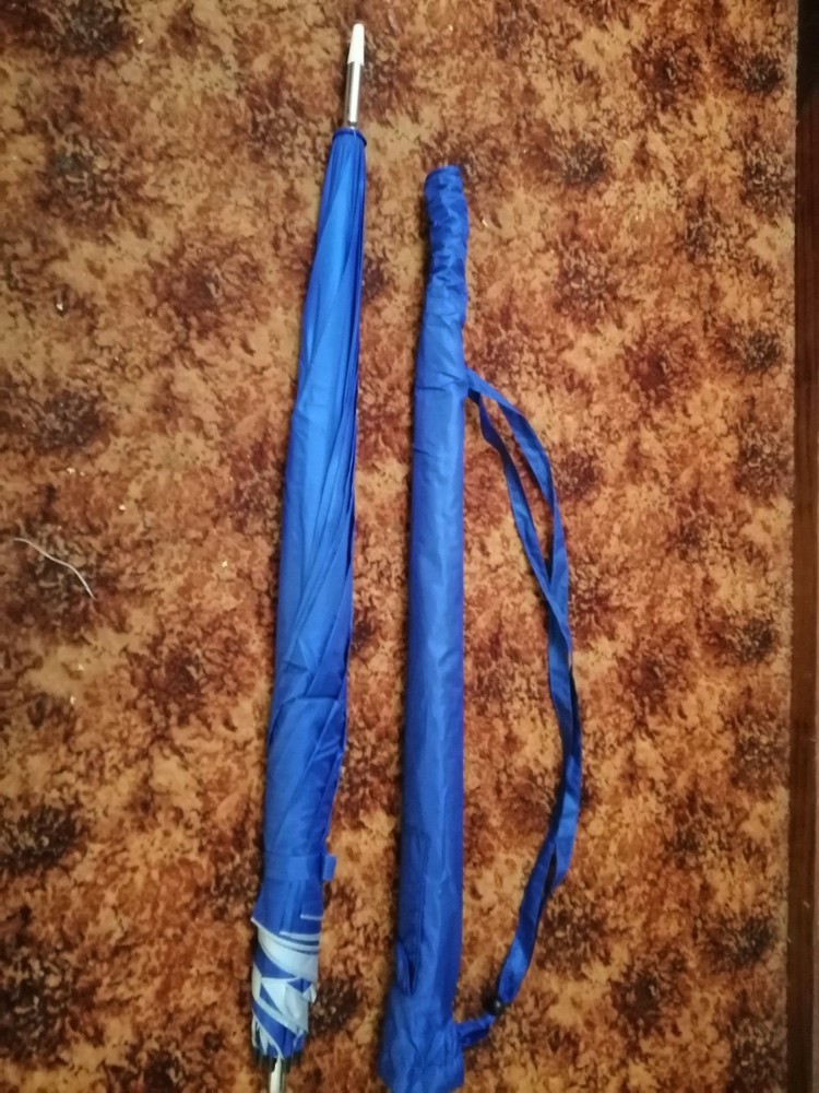 Golf umbrella with pole inside main pole for pushing into sand or soil, carrybag