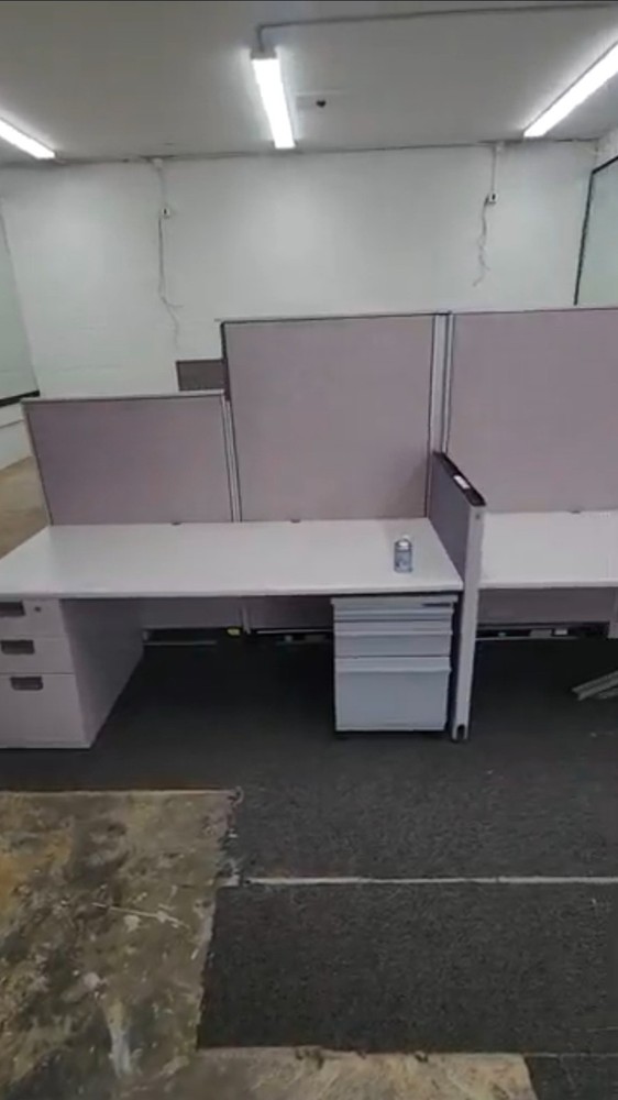Eight used office cubicles and office desk.
