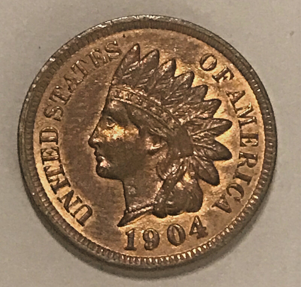 1904 Indian cent , uncirculated, mostly brown, some red remains