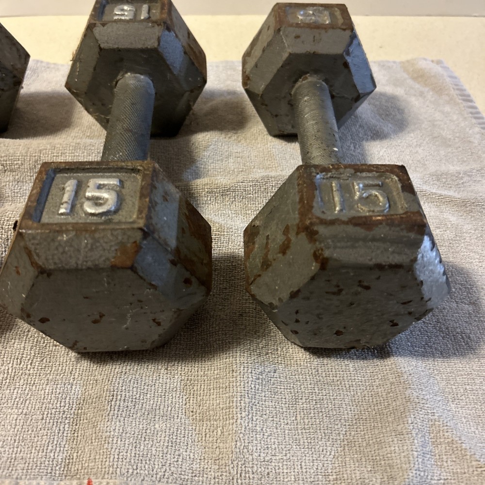 Three 15 Pound hex Head Cast Iron Dumbbells Silver