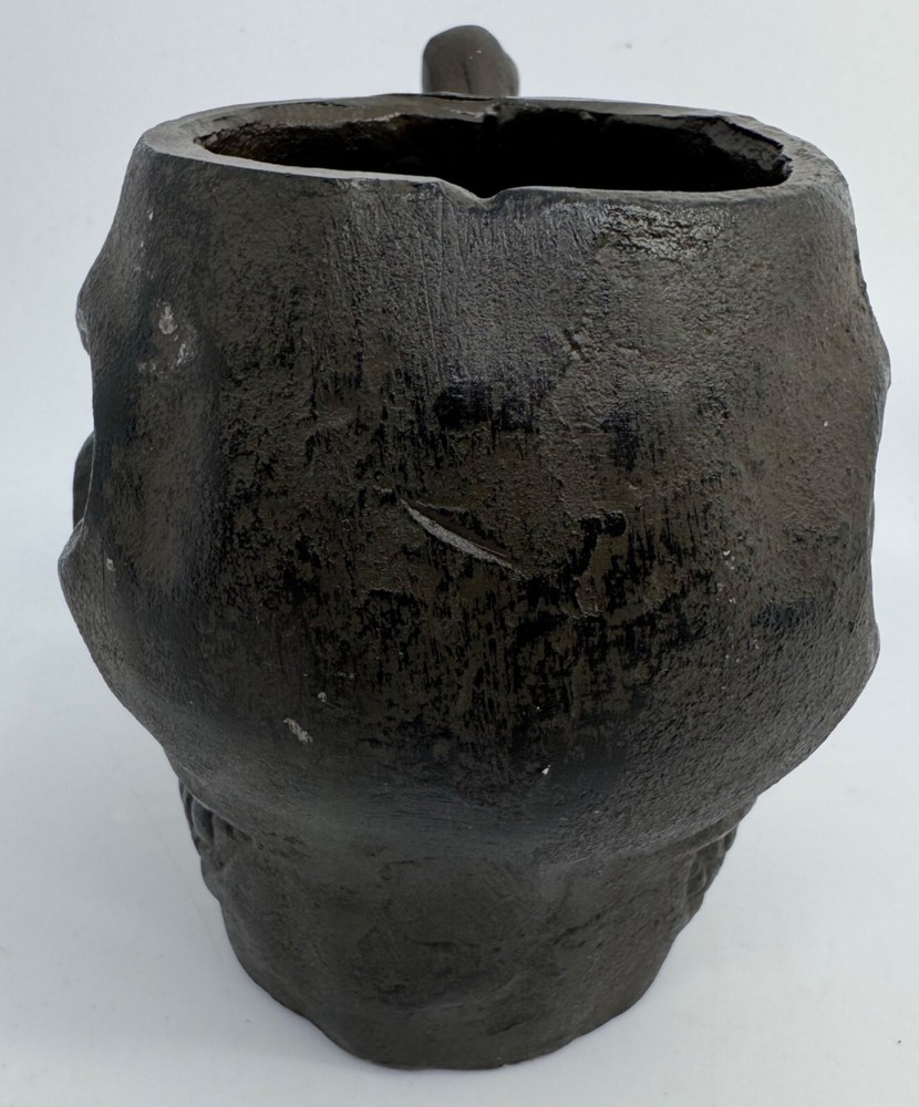 Cast Iron Skull-Shaped Bottomless Mug Thingy With Handle Both Ends And Eyes Open