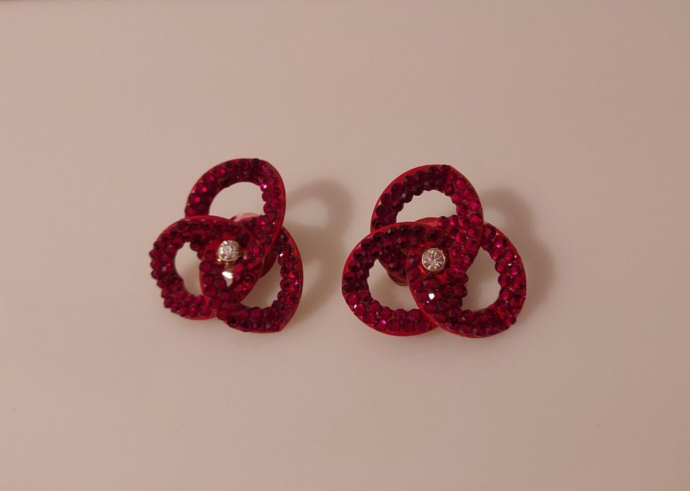 red rhinestone linked intertwined loop statement clip earrings