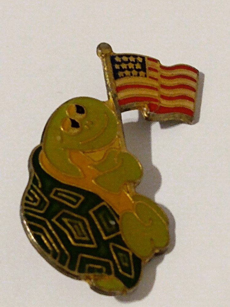 Turtle Figure Holding American Flag Lapel Pin