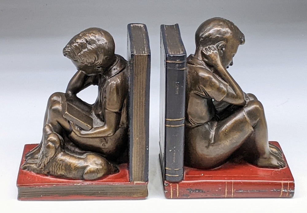 Boy reading with Dog  Bookends heavy !