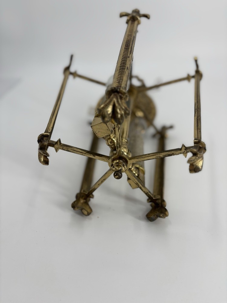 This is an antique lantern chandelier featuring fleur-de-lis finials.