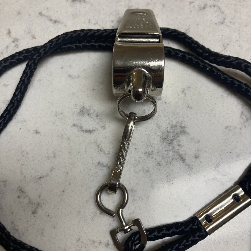 WHISTLE: WINDSOR CLARION BRASS WHISTLE WITH BLACK LANYARD(nice Condition)