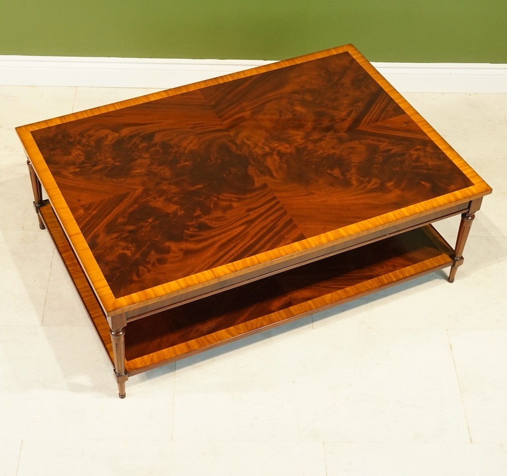 Rectangular Flamed Mahogany Coffee table with banding and lower shelf