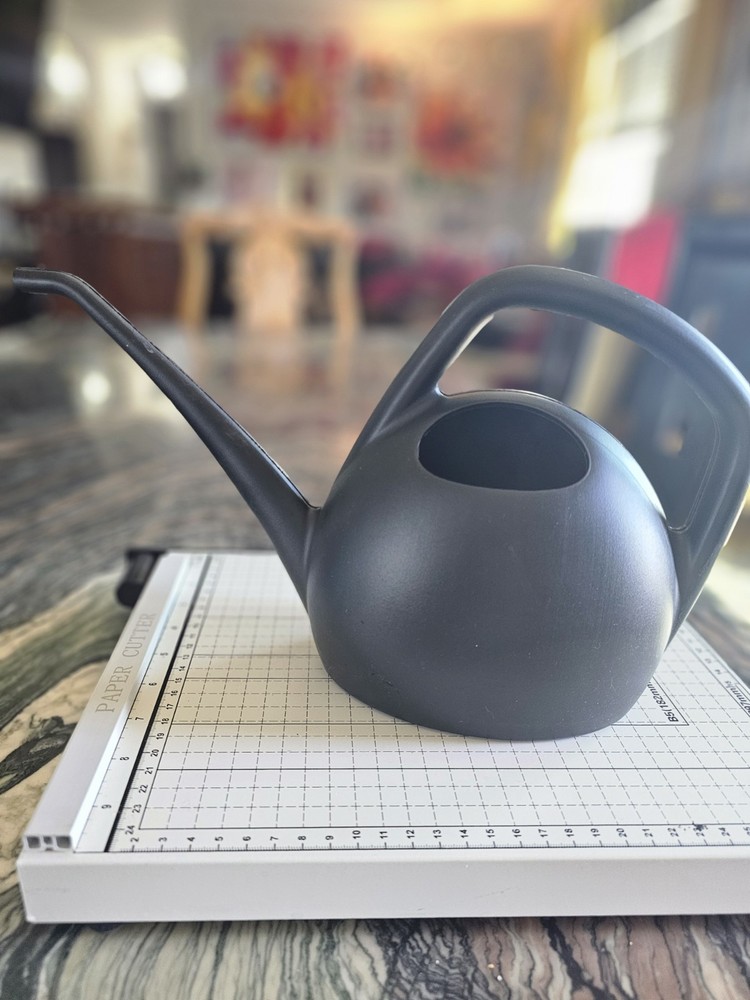 Watering can in blue or black