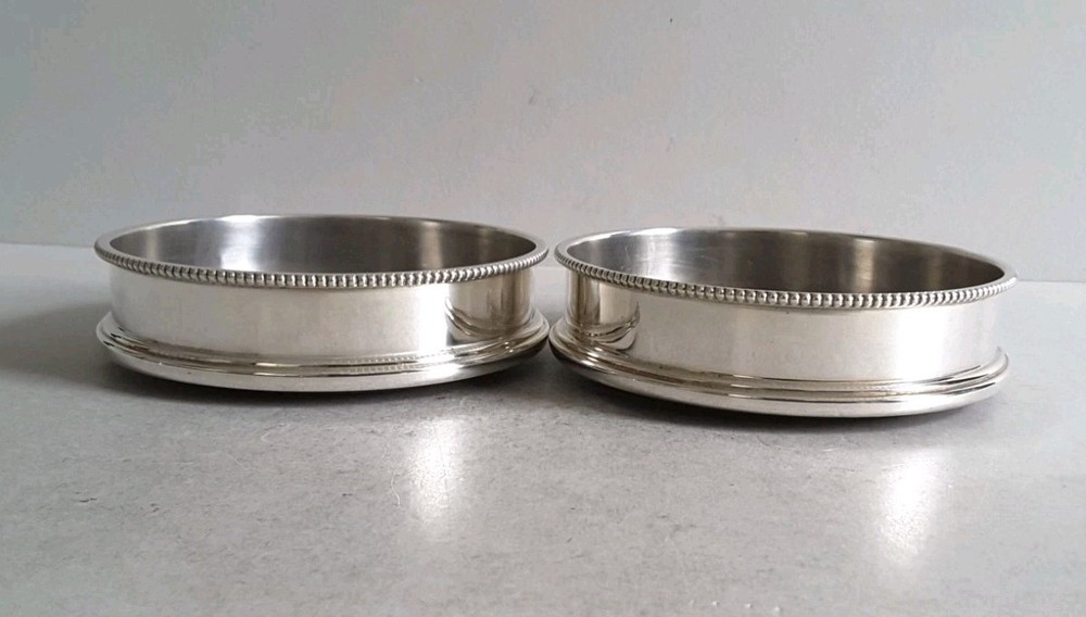 GOOD , PAIR VINTAGE SOLID SILVER COASTERS . 12 . 5 cms. dia. LON. 1973