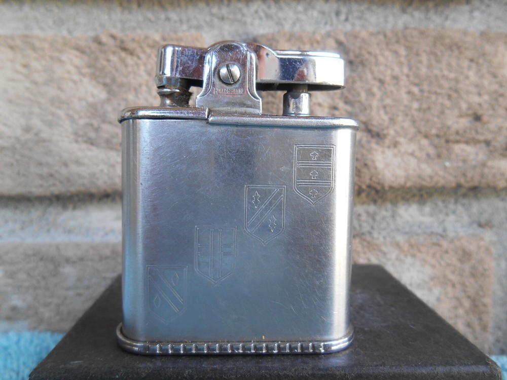Vintage Ronson WHIRLWIND CHROME CIGARETTE LIGHTER. ETCHED 14TH CENTURY SHIELDS