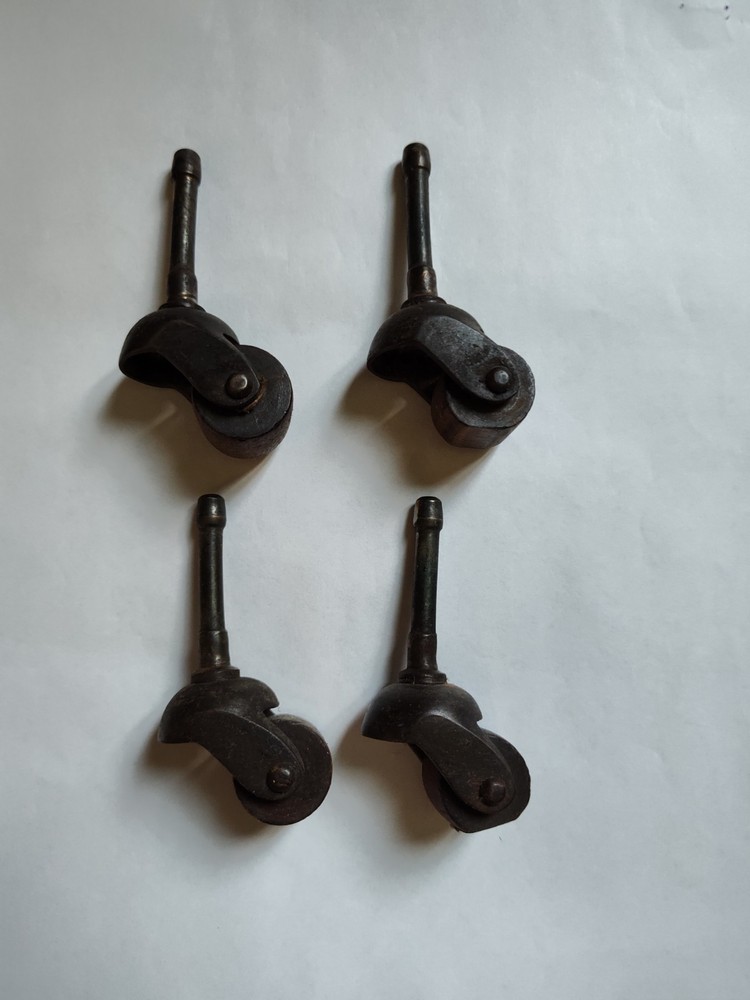 Four Antique Casters Wheels