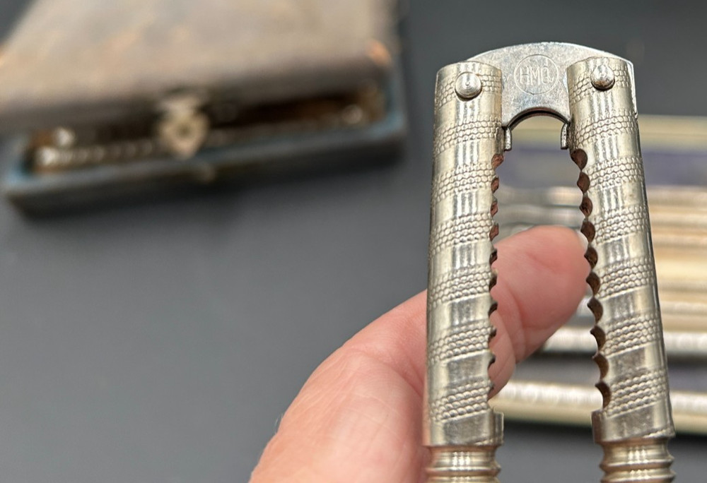 2 Vintage HMQ Metal Nut Cracker Sets. One Case