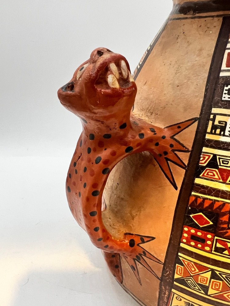 Peruvian ceramic stirrup vase with Jaguar handles and geometric designs