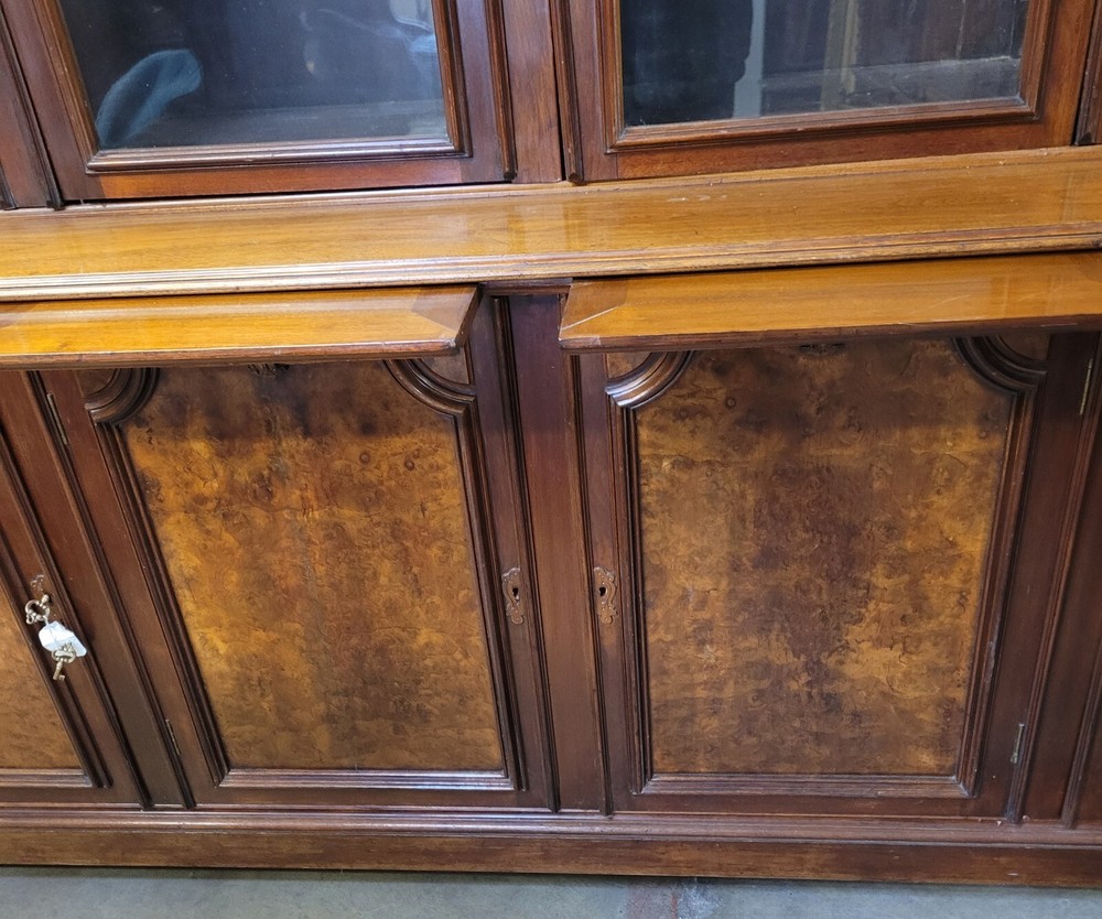 EXCEPTIONAL AMERICAN VICTORIAN WALNUT AND BURL BOOKCASE