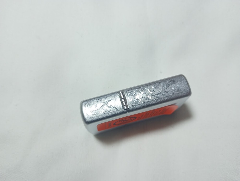 ---New unfired 2005 Zippo DWM monogram engraved lighter