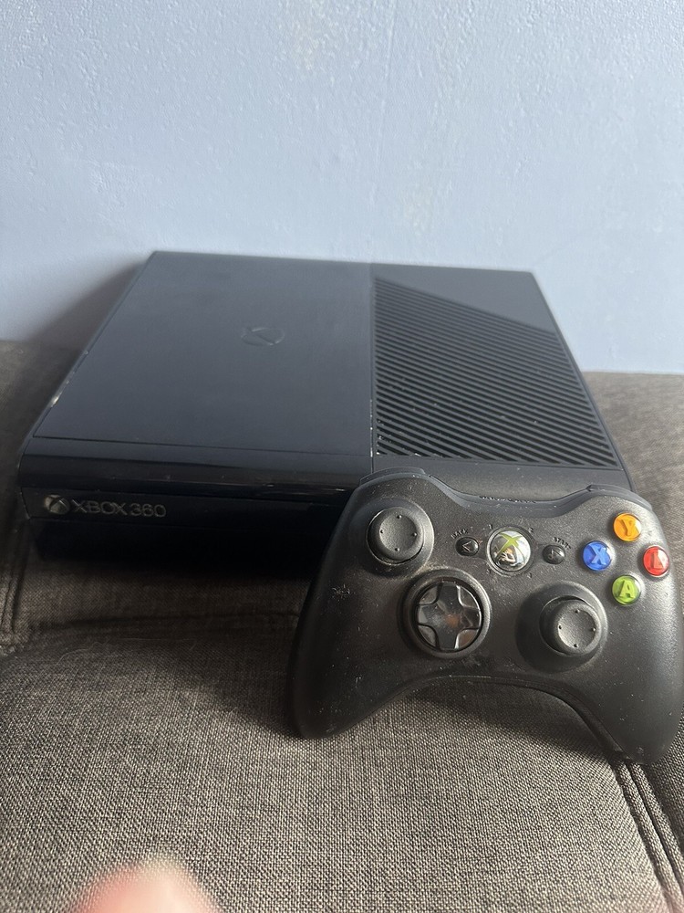 xbox 360 console with controller and games