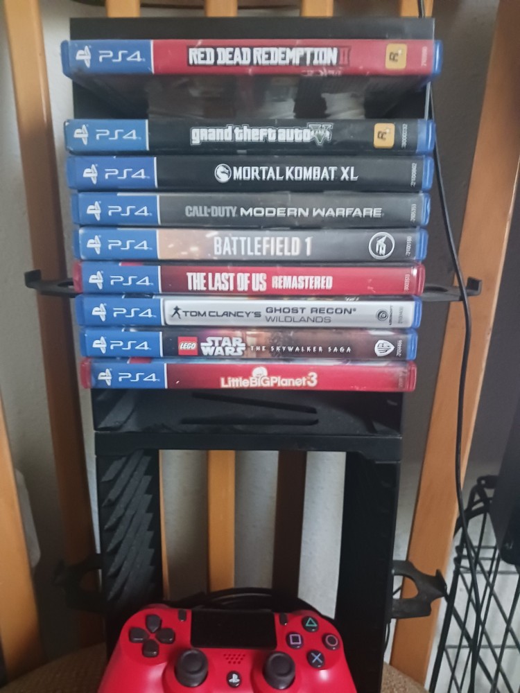 Ps4 Bundle Console With 3 Controllers, 8 Games, And a Game Storage Tower.