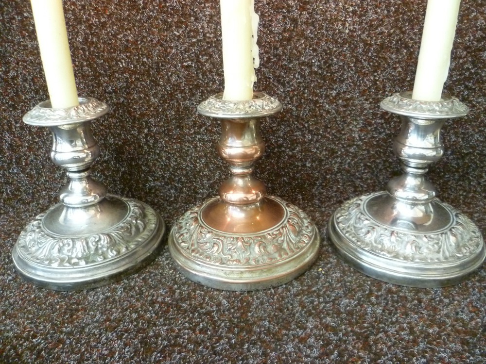THREE VICTORIAN SILVER ON COPPER CANDLESTICKS, TWO STICKS AND ONE CANDELABRA