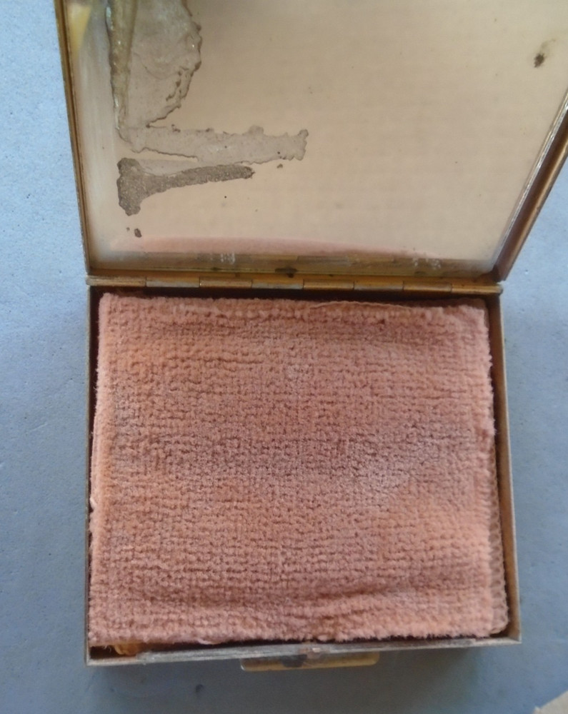 vintage compact with Merchant Marine pin on front