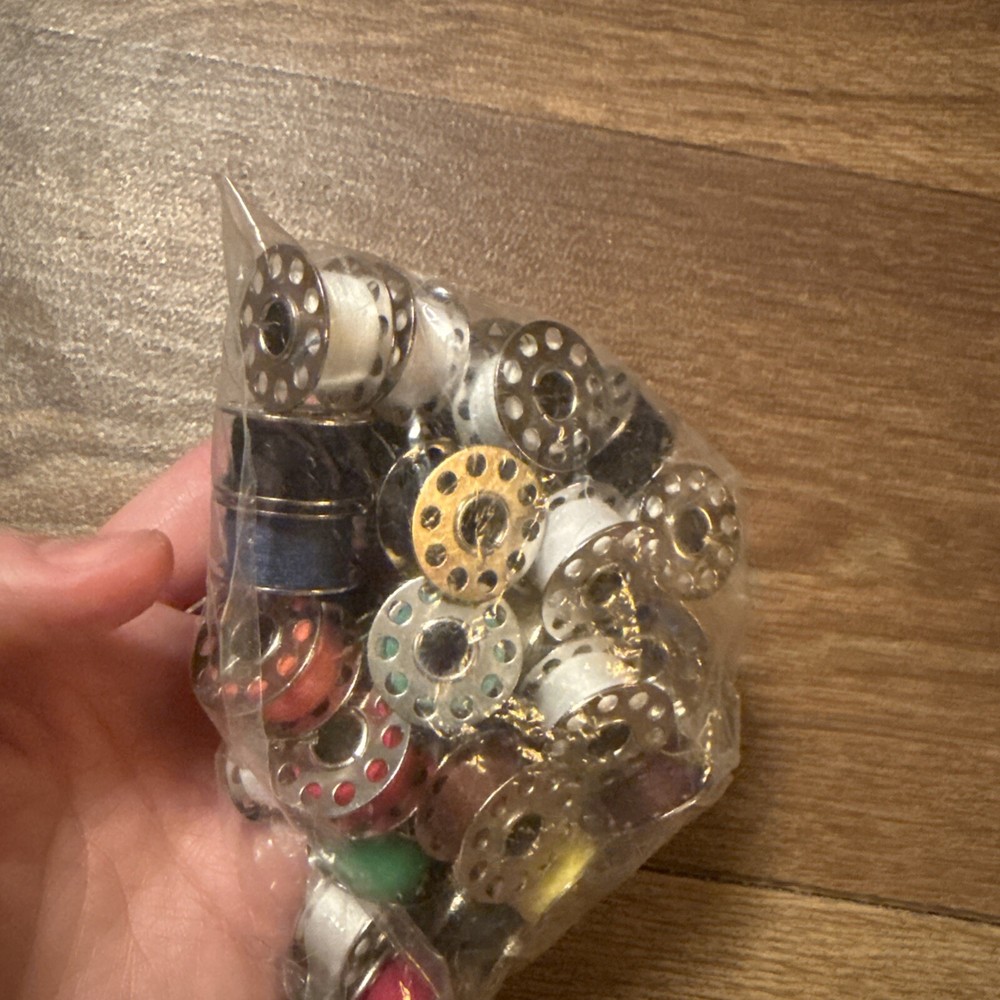 Lot Of Threaded Sewing Machine Bobbins