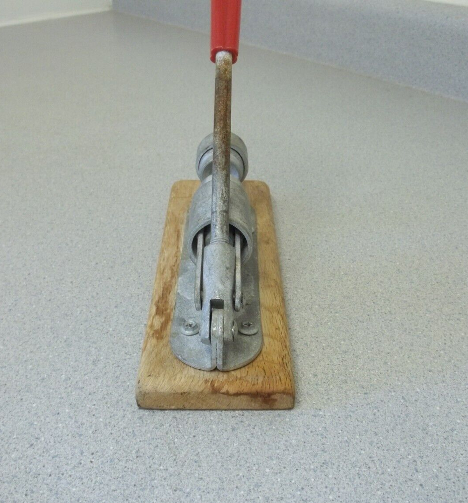 Nutcracker with red handle knob on wooden base Vintage adjustable nutcracker