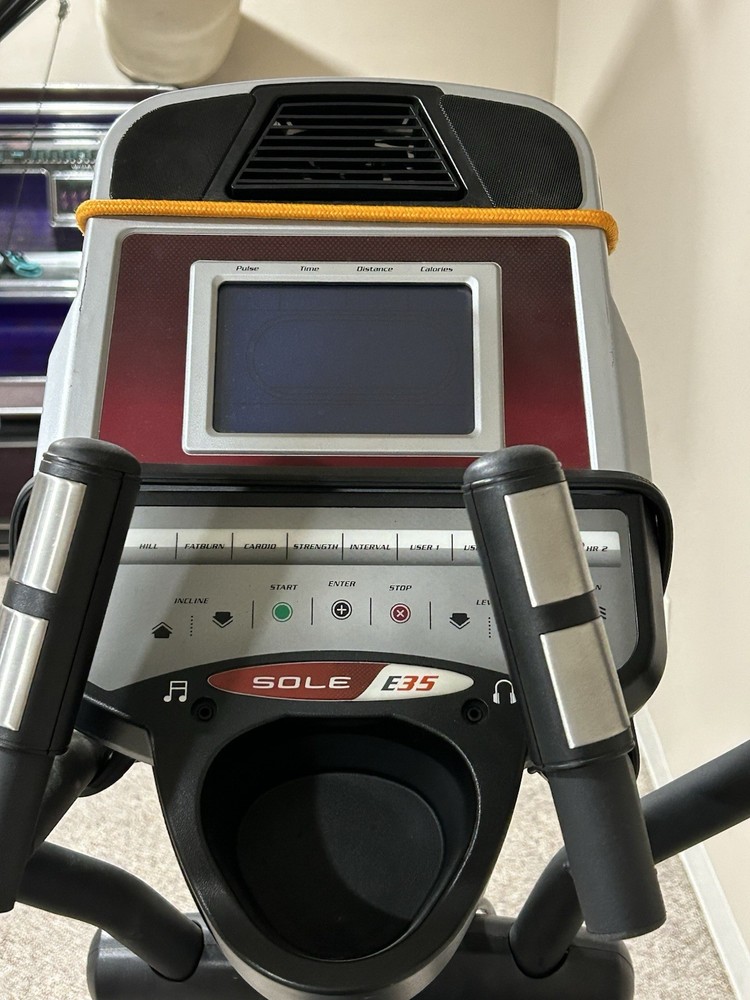 Sole E35 elliptical machine, featuring its digital display panel, dual handlebar