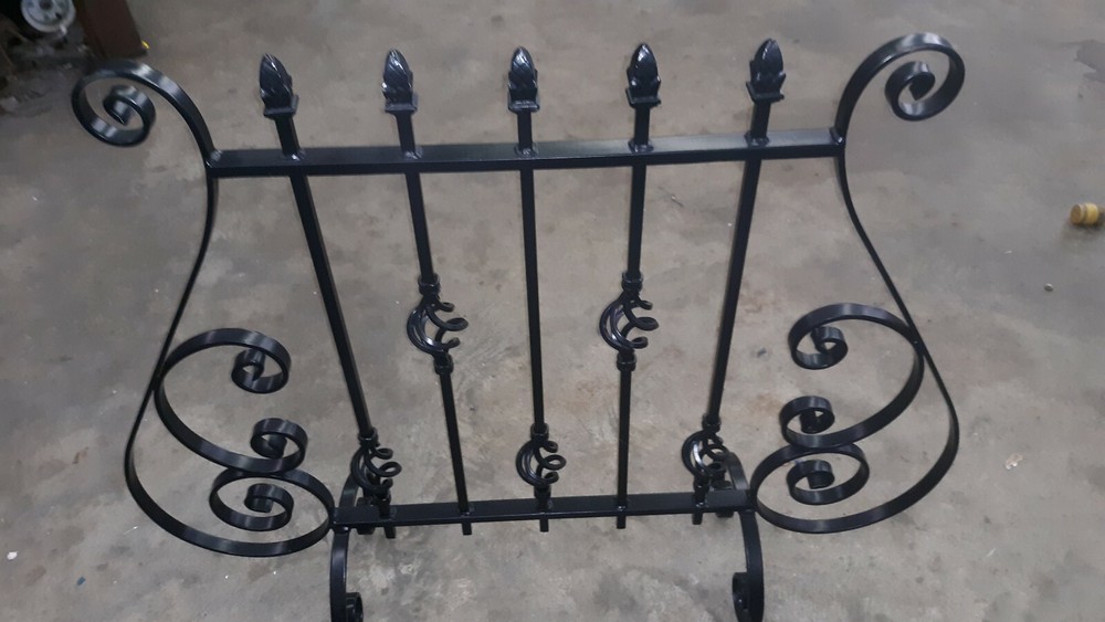 DECORATIVE  ROUT IRON . FIREPLACE SCREEN