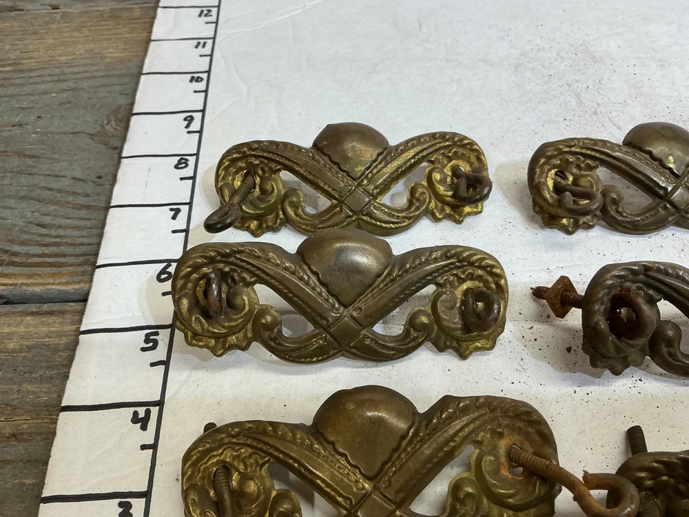 7 VINTAGE STAMPED BRASS DRAWER PULLS